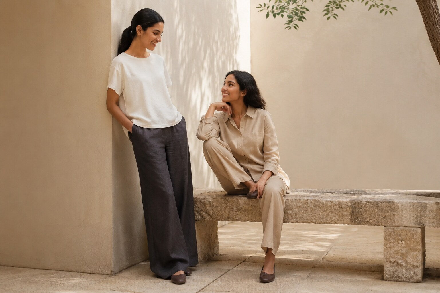 Two women wearing relaxed neutral clothing